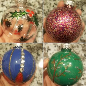 four painted christmas ornaments